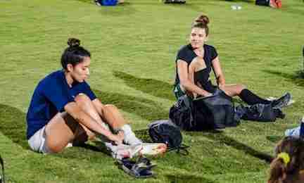 Women Preparing for Soccer Match
